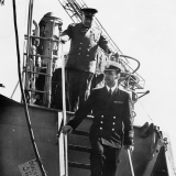 Посещение Н. С. Хрущевым 4 мая 1962 г. РКР «Грозный». Завод им. А. А. Жданова. Командир корабля проводит гостей по верхней палуб